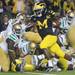 Michigan junior quarterback Denard Robinson runs in a fumble recovery for a touchdown during the fourth quarter against Notre Dame on Saturday. Melanie Maxwell I AnnArbor.com